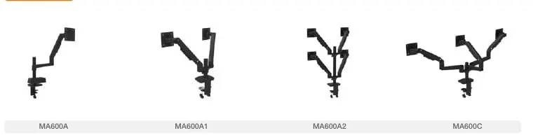 Dark dual gas-spring monitor arms with VESA plates and clamp power ports on an oak sit-stand desk